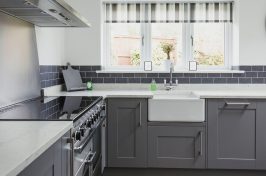 Classic styled kitchen with grey cupboard doors